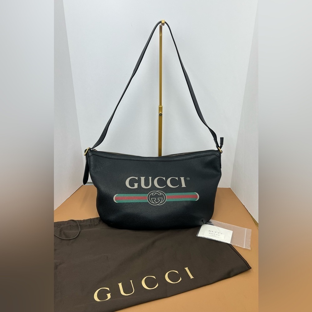 GUCCI Authentic.Half-Moon leather Bag with inspired vintage logo style.
